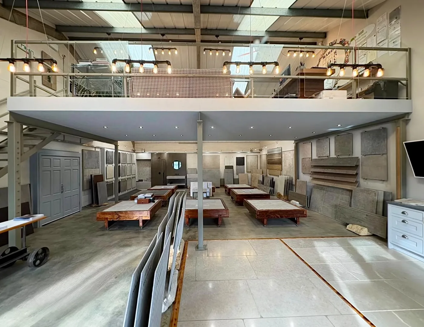 The showroom ground floor, tiles and stone on display under the mezzanine